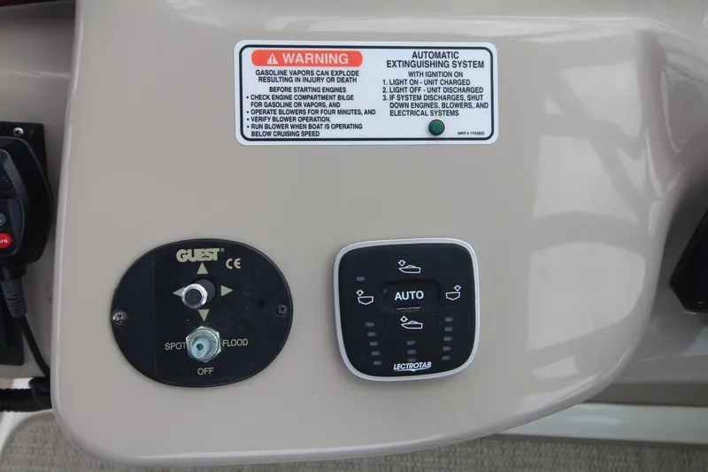 Slide: The Image of Control panel of a 2008 Sea Ray 340 Sundancer boat with warning label and switches. - 12