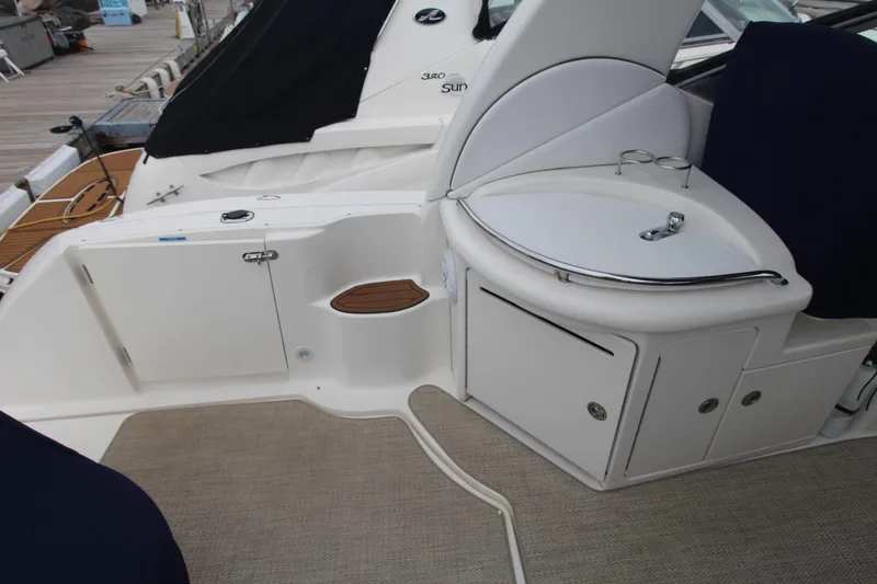 Slide: The Image of 2008 Sea Ray 340 Sundancer boat interior with sink and storage compartments. - 14