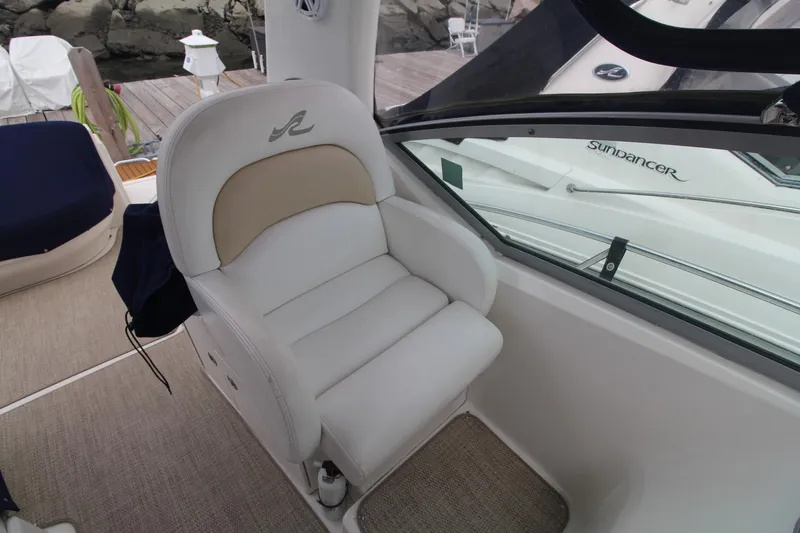 Slide: The Image of Captain's chair on 2008 Sea Ray 340 Sundancer yacht, docked with visible deck and railing. - 19