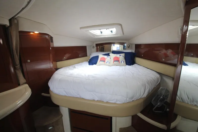 Slide: The Image of Luxurious cabin interior of 2008 Sea Ray 340 Sundancer with cozy bed and elegant wood finish. - 25