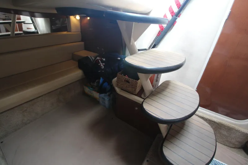 Slide: The Image of 2008 Sea Ray 340 Sundancer cabin interior with stairs and seating area. - 28