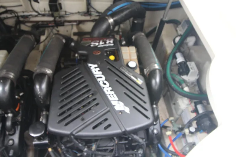 Slide: The Image of Engine compartment of a 2008 Sea Ray 340 Sundancer with Mercury components. - 32