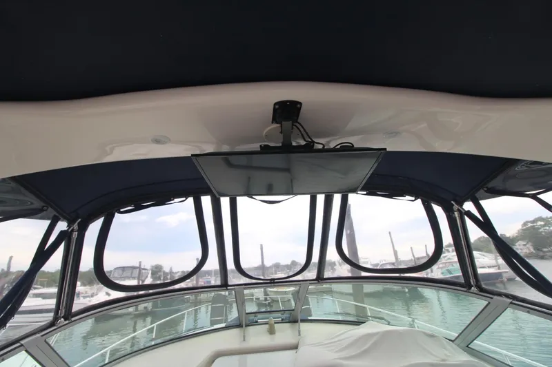 Slide: The Image of 2008 Sea Ray 340 Sundancer helm with panoramic marina view. - 9