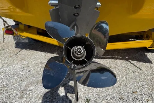 Slide: The Image of Propeller of 2005 Crownline 210 LPX boat on gravel surface, close-up view. - 14