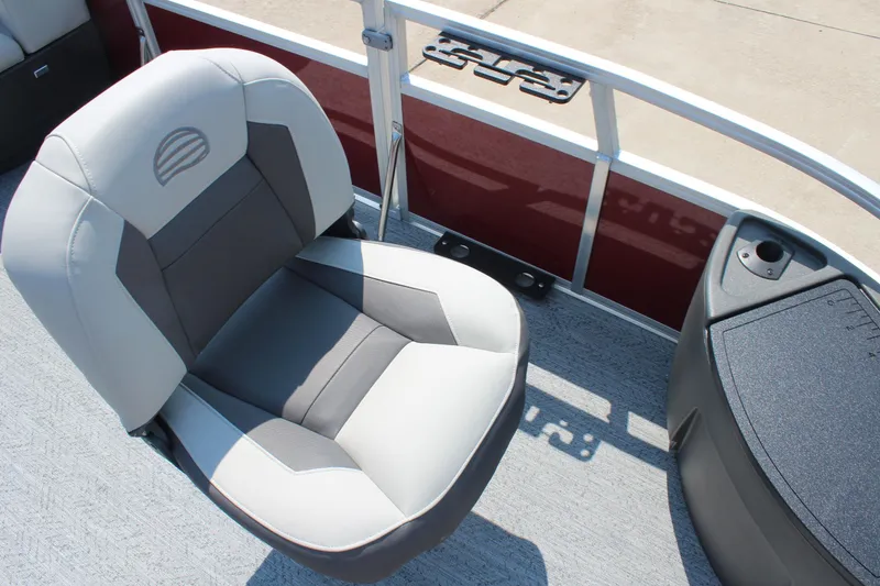 Slide: The Image of 2026 Sun Tracker Bass Buggy 18 DLX boat seat with cup holder and railing. - 10