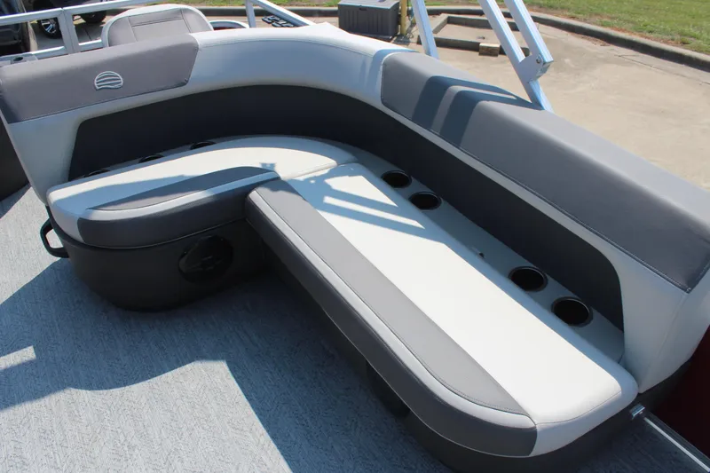 Slide: The Image of 2026 Sun Tracker Bass Buggy 18 DLX boat seating with cup holders, gray and white upholstery. - 14