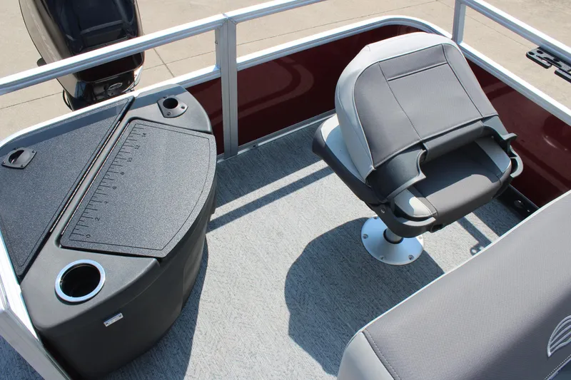 Slide: The Image of 2026 Sun Tracker Bass Buggy 18 DLX boat interior with seating and storage features. - 17