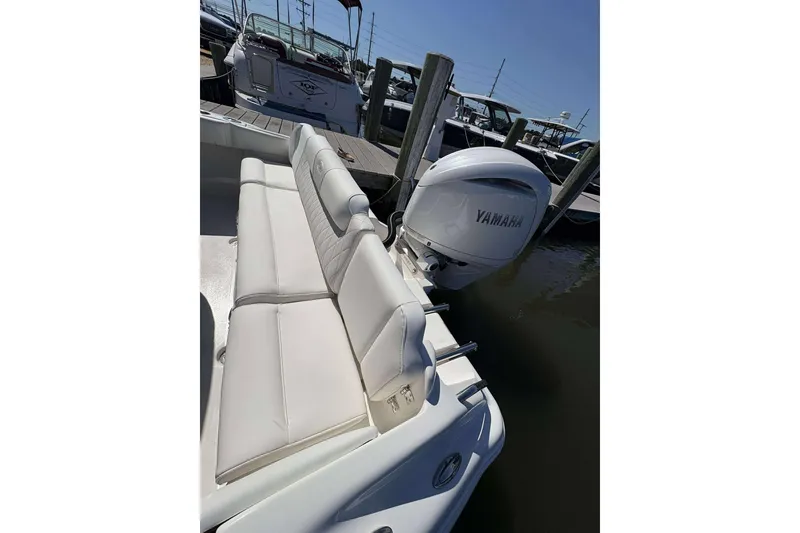 Slide: The Image of 2026 Key West 219 FS boat with Yamaha engine, docked at marina. - 17