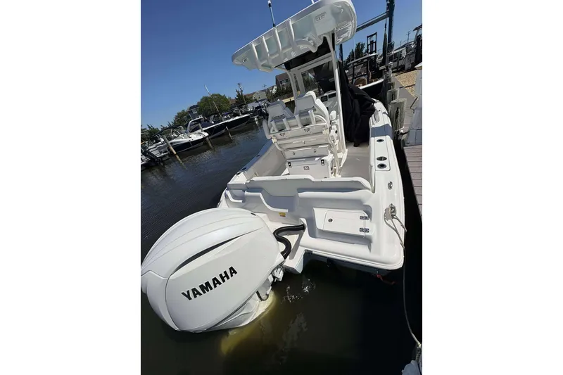 Slide: The Image of 2026 Key West 219 FS boat with Yamaha outboard engine docked at marina. - 18