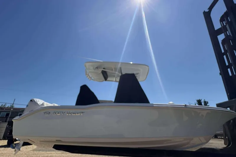 Slide: The Image of 2026 Key West 219 FS boat under bright sun, showcasing sleek design and modern features. - 5
