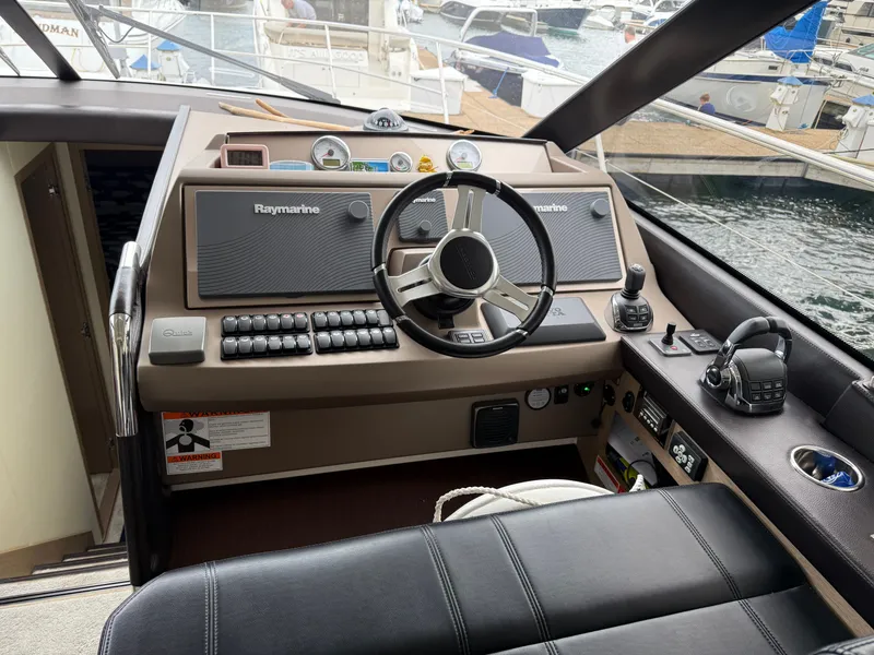 Slide: The Image of Cockpit of 2018 Prestige 500 S yacht with Raymarine navigation system and leather seating. - 6