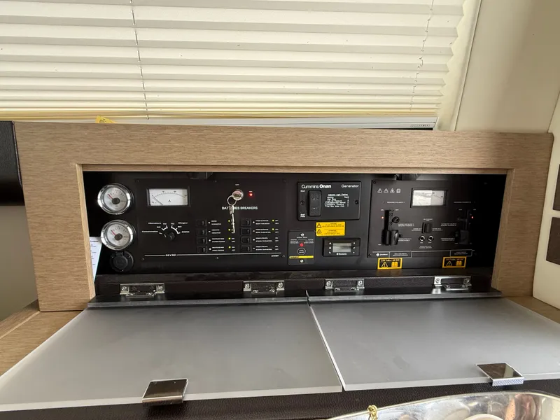 Slide: The Image of Control panel of a 2018 Prestige 500 S yacht, featuring gauges and switches. - 7