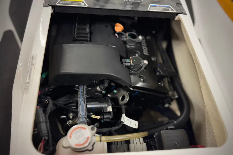 Slide: The Image of Engine compartment of a 2019 Sea-Doo Fish Pro 155, showcasing internal components. - 11