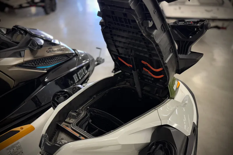 Slide: The Image of 2019 Sea-Doo Fish Pro 155 with open storage compartment, showcasing interior features. - 12