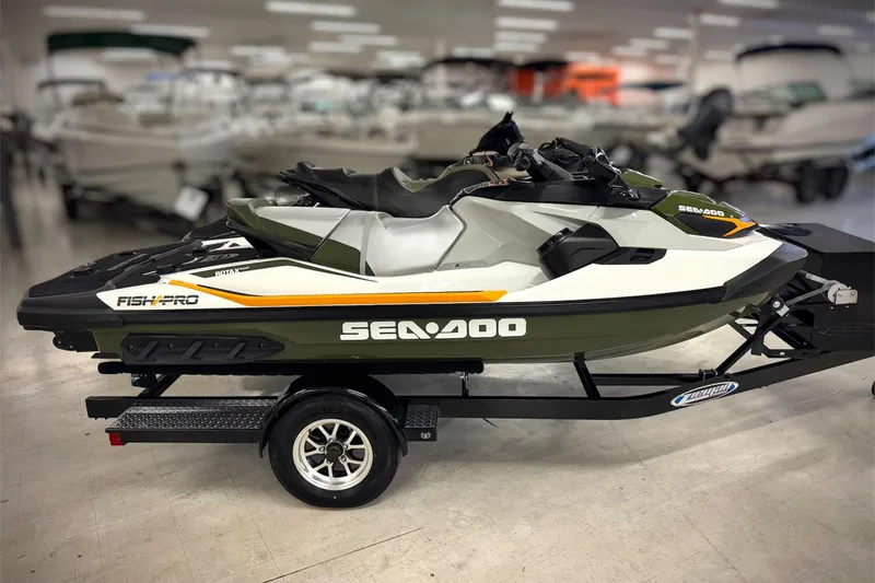 Slide: The Image of 2019 Sea-Doo Fish Pro 155 jet ski on trailer in showroom. - 6