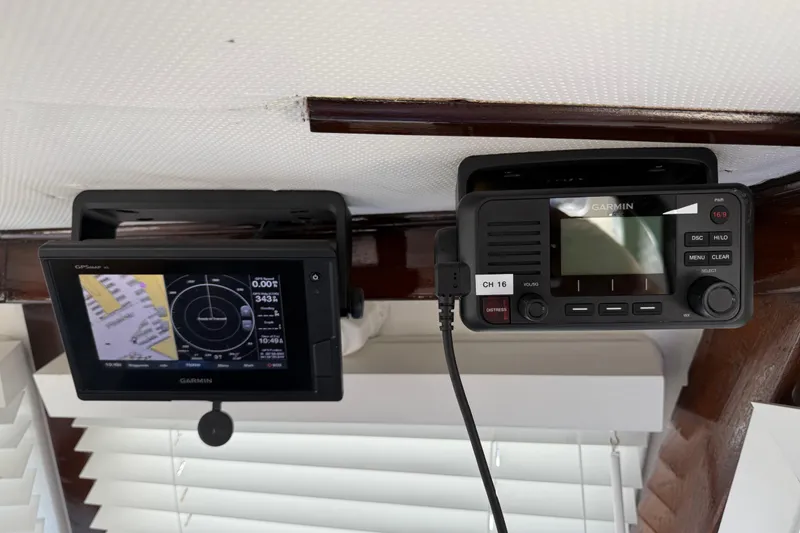 Slide: The Image of Garmin marine electronics on a 1978 CHB 34 boat, featuring GPS and communication devices. - 33