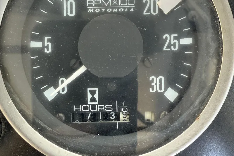 Slide: The Image of Close-up of a vintage 1978 CHB 34 tachometer gauge displaying RPM and hours. - 35