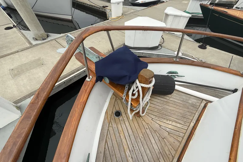 Slide: The Image of Bow of a 1978 CHB 34 boat with anchor and ropes at a marina. - 7