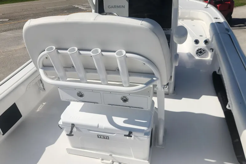 Slide: The Image of 2026 Tidewater 2500 Carolina Bay boat interior with rod holders and Yeti cooler. - 10