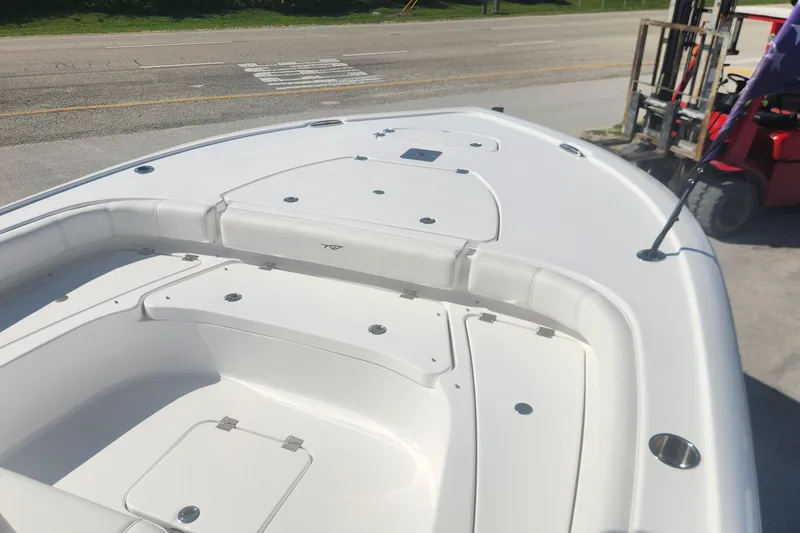 Slide: The Image of 2026 Tidewater 2500 Carolina Bay boat with spacious deck and seating area. - 13