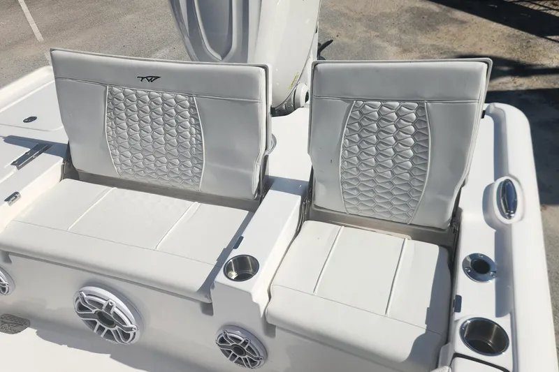 Slide: The Image of 2026 Tidewater 2500 Carolina Bay boat seats with quilted design and cup holders. - 15