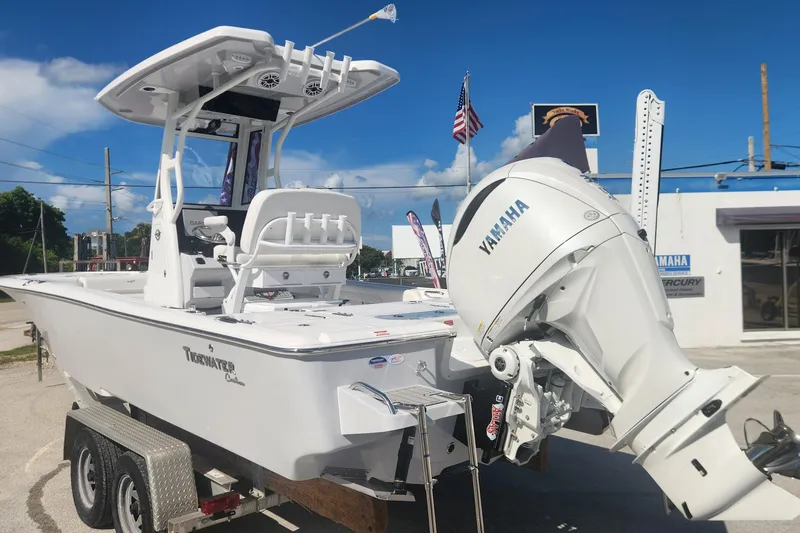Slide: The Image of 2026 Tidewater 2500 Carolina Bay boat with Yamaha engine on trailer, outdoor dealership setting. - 7