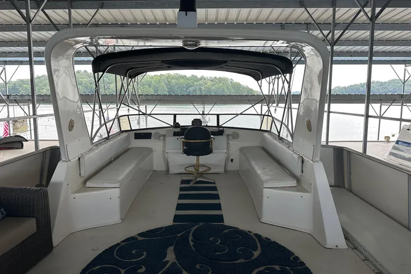 Slide: The Image of 1997 Stardust Cruisers 16x78 houseboat interior with seating and helm under canopy. - 17