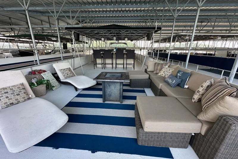 Slide: The Image of Spacious deck of 1997 Stardust Cruisers 16x78 with comfortable seating and stylish decor. - 19