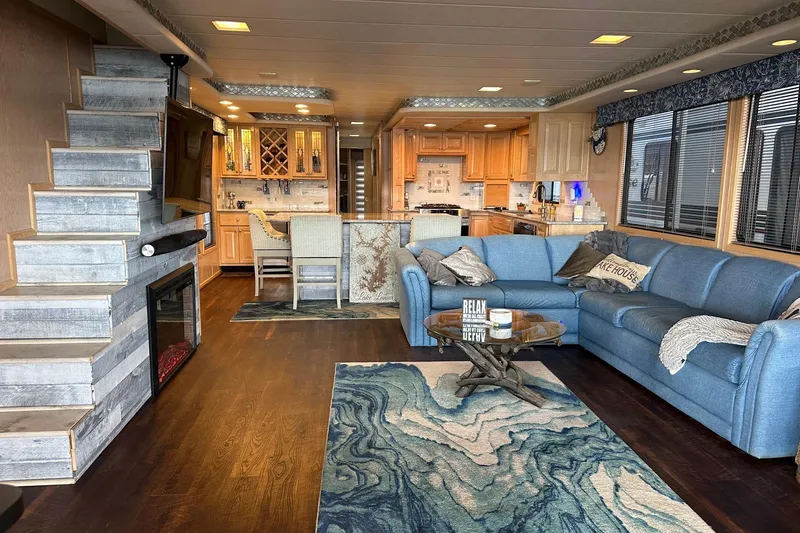 Slide: The Image of Luxurious 1997 Stardust Cruisers 16x78 houseboat interior with modern kitchen and cozy living area. - 2