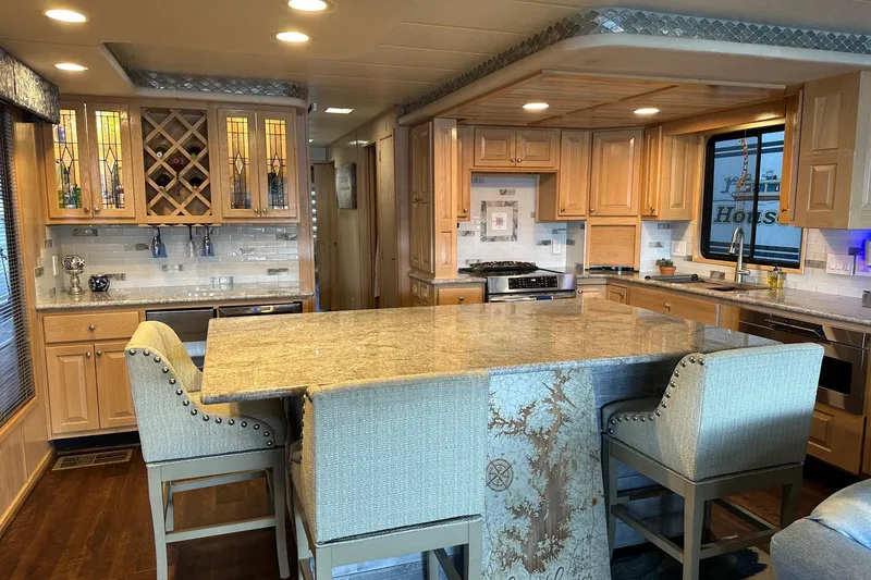 Slide: The Image of Luxurious kitchen interior of 1997 Stardust Cruisers 16x78 houseboat with granite countertops. - 4