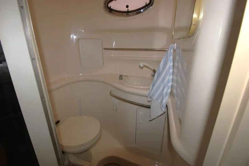 Slide: The Image of Bathroom interior of 1998 Sea Ray 330 Sundancer yacht, featuring compact design and amenities. - 19