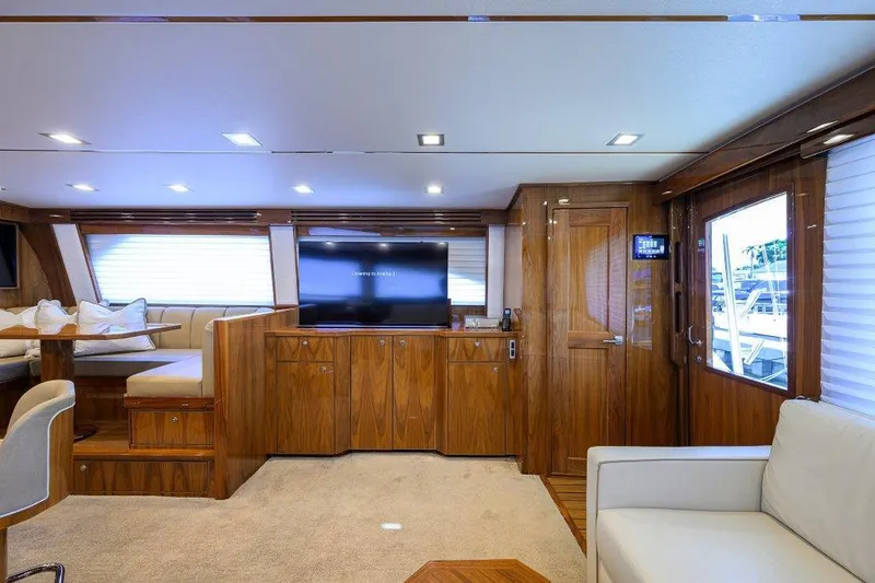 Slide: The Image of Luxurious interior of 2020 Viking 72 Convertible yacht with modern furnishings and entertainment system. - 11