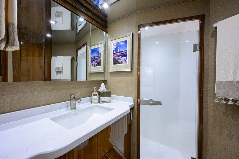Slide: The Image of Luxurious bathroom in 2020 Viking 72 Convertible yacht with modern fixtures and elegant decor. - 23