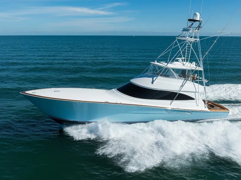 Slide: The Image of 2020 Viking 72 Convertible yacht cruising on open sea, showcasing sleek design and performance. - 5