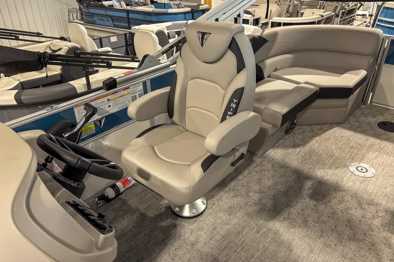Slide: The Image of 2025 Trifecta 20RF LE boat interior with plush seating and modern steering console. - 10