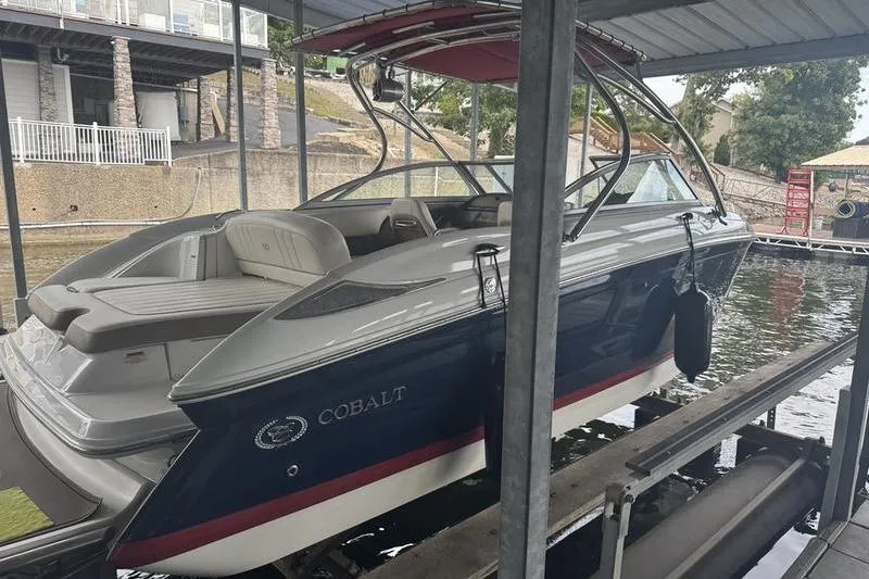 Slide: The Image of 2012 Cobalt 242 WSS boat engine compartment with open hatch. - 6