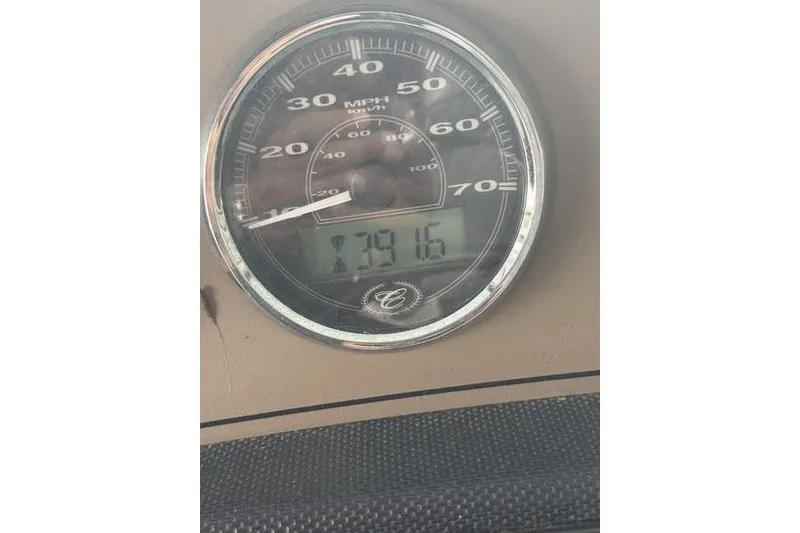 Slide: The Image of 2012 Cobalt 242 WSS boat interior with white seating and blue rope. - 9