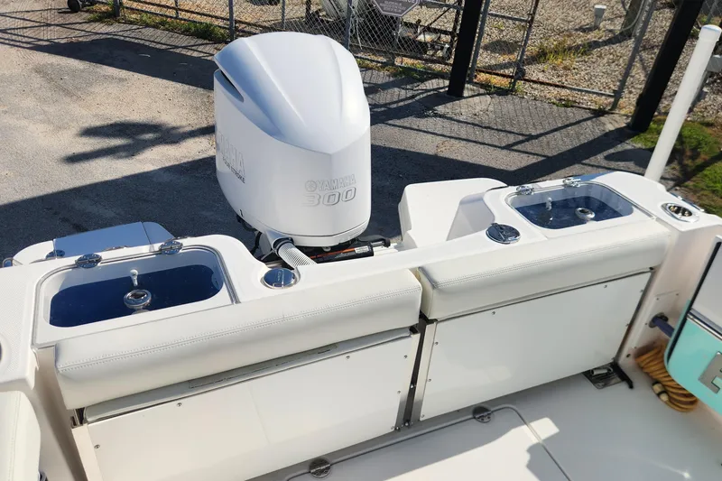 Slide: The Image of 2022 Everglades 235 Center Console boat with Yamaha 300 engine, featuring dual livewells. - 14