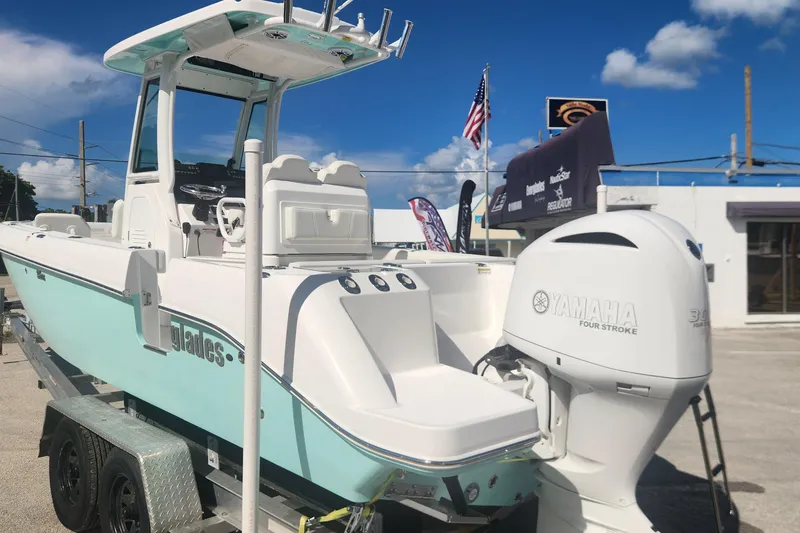 Slide: The Image of 2022 Everglades 235 Center Console boat with Yamaha engine on trailer. - 6