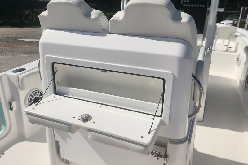 Slide: The Image of 2022 Everglades 235 Center Console boat with open storage compartment. - 9