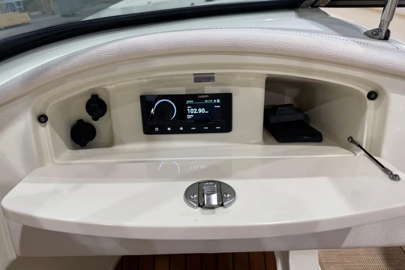 Slide: The Image of Dashboard of 2021 Chris-Craft Launch 23 boat with radio display and controls. - 13