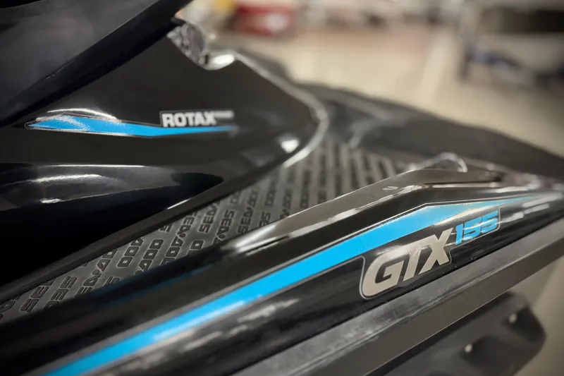 Slide: The Image of Close-up of 2016 Sea-Doo GTX 155 with Rotax engine branding. - 6
