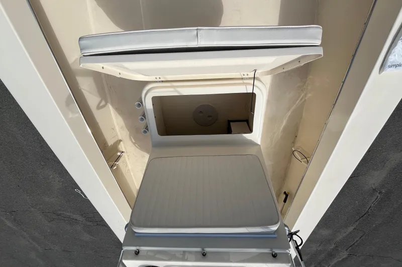 Slide: The Image of 2025 Jones Brothers 23 Cape Fisherman Lite Tackle boat interior storage compartment. - 13