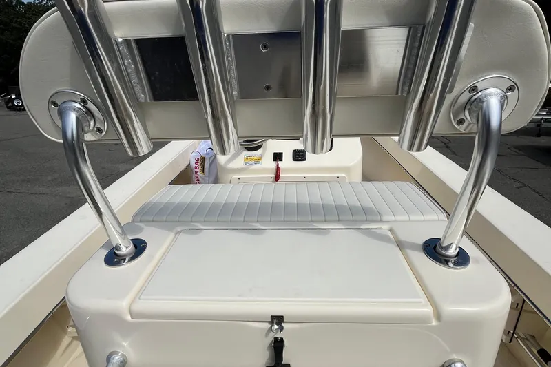 Slide: The Image of 2025 Jones Brothers 23 Cape Fisherman Lite Tackle boat interior with rod holders and seating. - 15