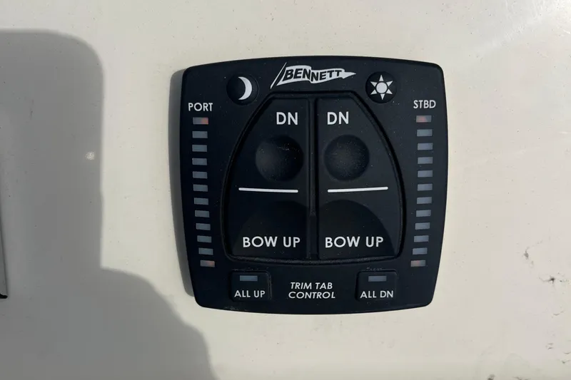 Slide: The Image of Bennett trim tab control panel on 2025 Jones Brothers 23 Cape Fisherman Lite Tackle boat. - 17
