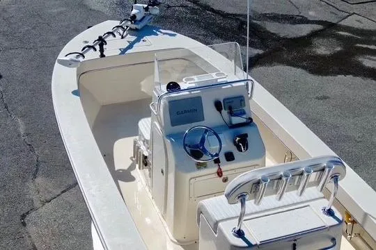 Slide: The Image of 2025 Jones Brothers 23 Cape Fisherman Lite Tackle boat with modern console and seating. - 20