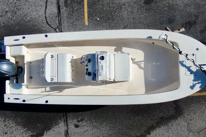 Slide: The Image of Overhead view of 2025 Jones Brothers 23 Cape Fisherman Lite Tackle boat on pavement. - 3