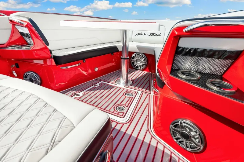 Slide: The Image of Luxurious 2022 Nor-Tech 390 SS boat interior with red and white seating and modern amenities. - 35