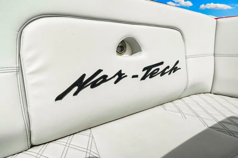 Slide: The Image of White leather seating with Nor-Tech logo on 2022 Nor-Tech 390 SS boat. - 40