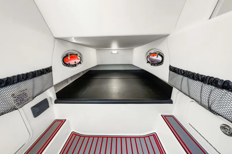 Slide: The Image of Interior cabin of 2022 Nor-Tech 390 SS boat, featuring sleek design and storage nets. - 45